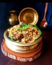 Goat Kizhi Biryani - Main Courses